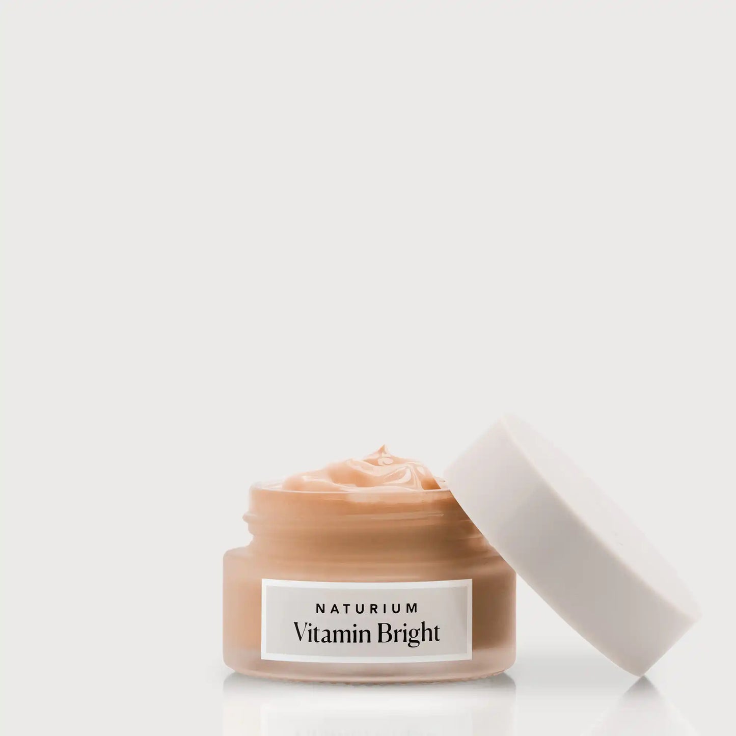 vitamin-bright-illuminating-eye-cream-l2 NATR-VitaminBright_DEEP_Primary_front_openjar_bone.webp