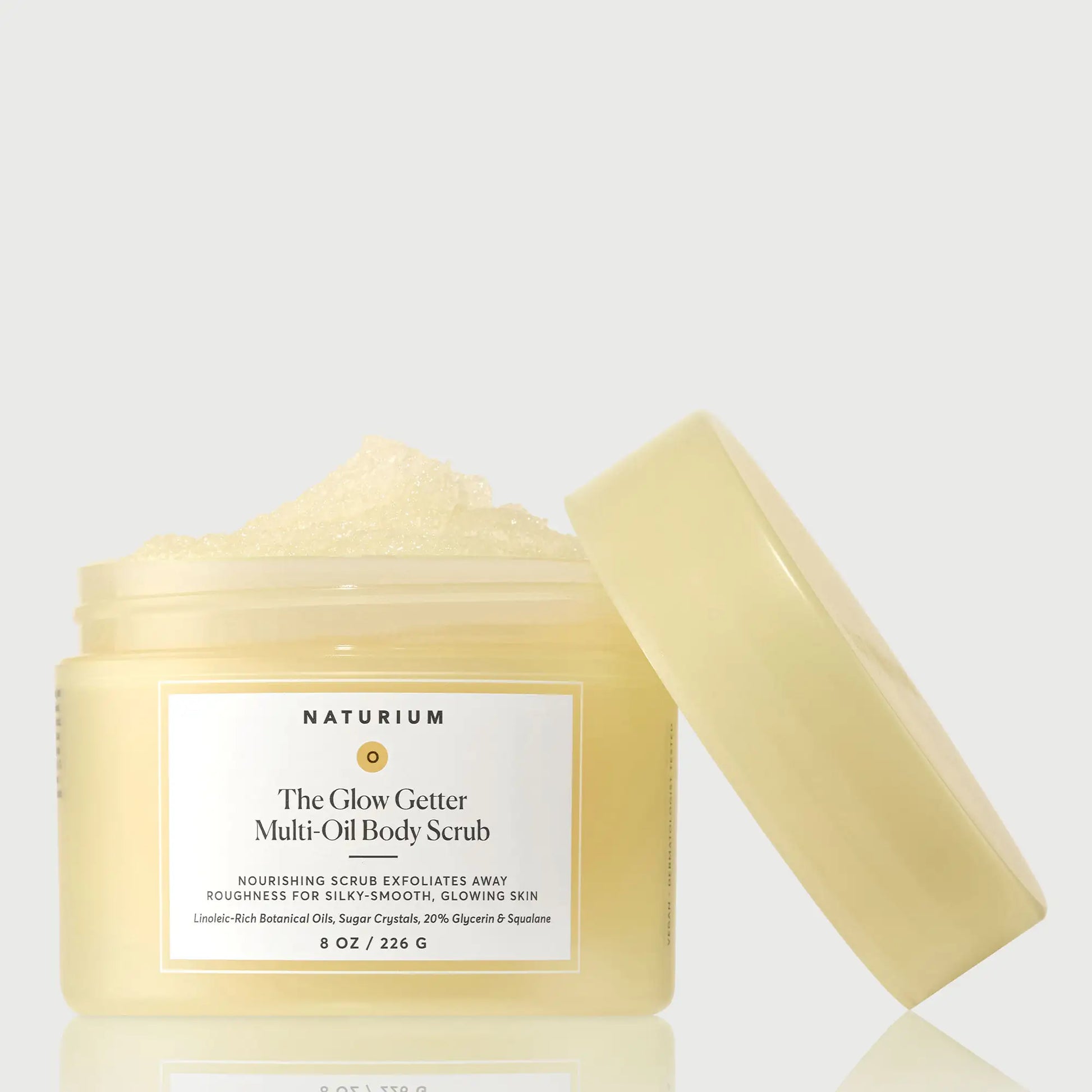 the-glow-getter-multi-oil-body-scrub-o8 NATR-40028-GlowGetter-Multi-Oil-Body-Scrub-Front-CapOff-bonebkgd.webp